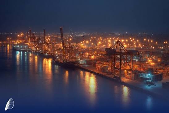 Industrial port lights reflected on the water